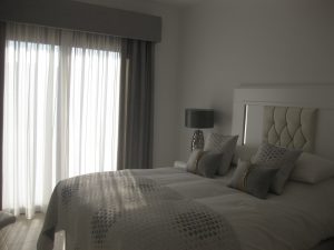 Upholstered pelmet and matching bed linen & cushions look stunning