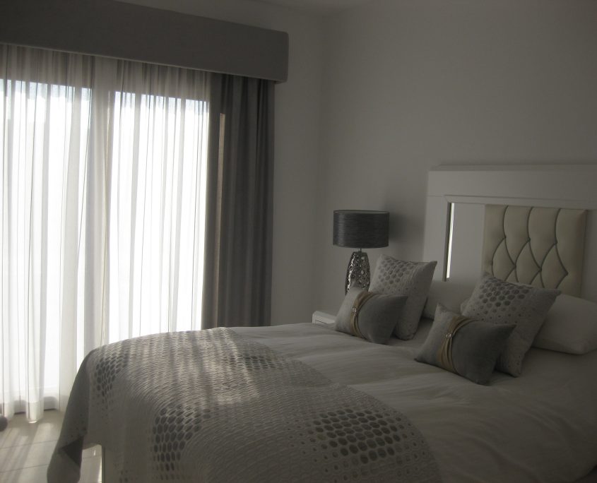 Upholstered pelmet and matching bed linen & cushions look stunning